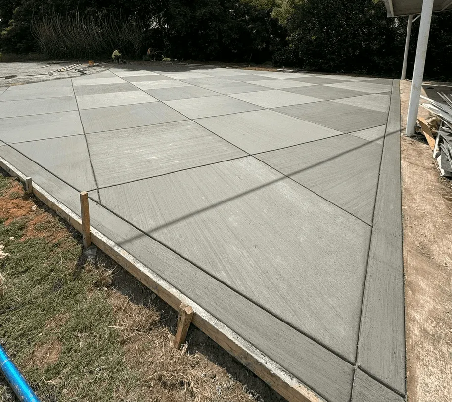 Decorative checkered pattern concrete patio finished by Concrete Star in Calgary