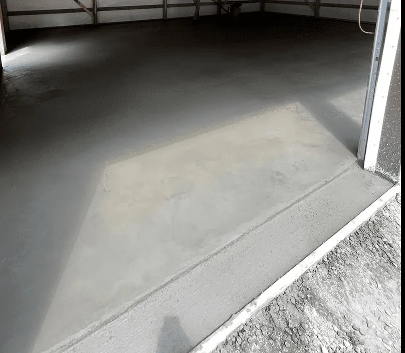 Freshly poured smooth finish concrete garage floor in Calgary by Concrete Star