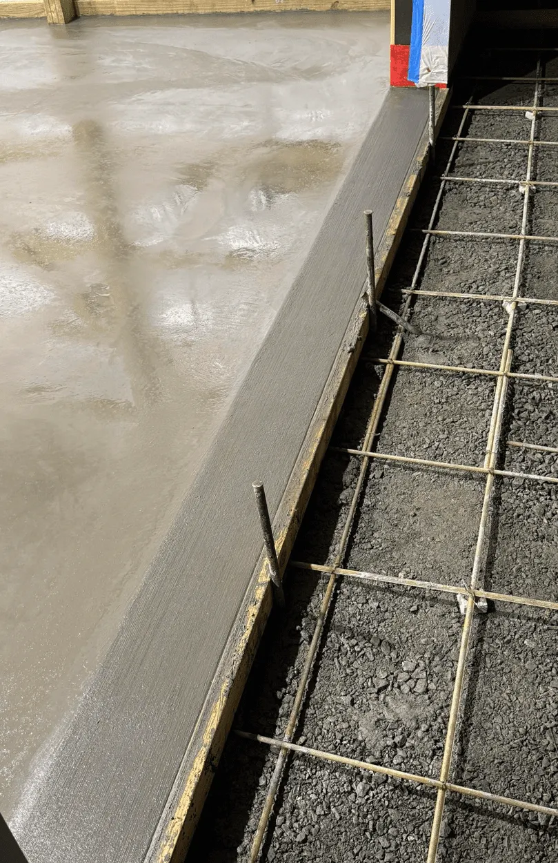 Concrete garage floor with rebar reinforcement grid ready for next pour in Calgary by Concrete Star
