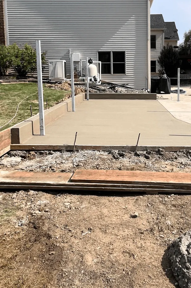 New concrete driveway installation with forms and control joints at a Calgary home by Concrete Star