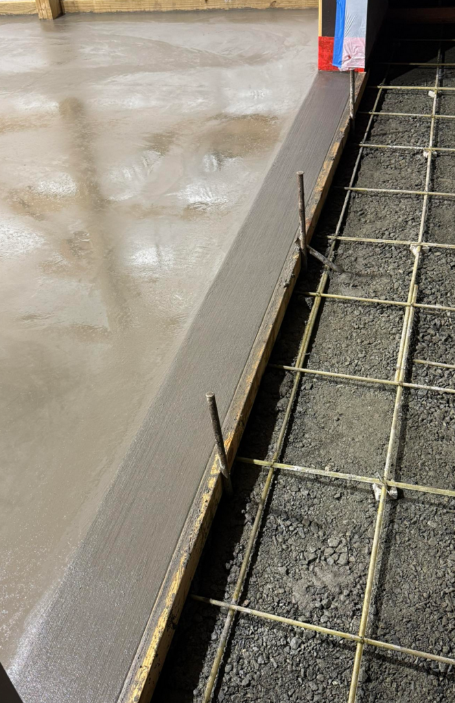 Concrete garage floor with rebar reinforcement grid ready for next pour in Calgary by Concrete Star
