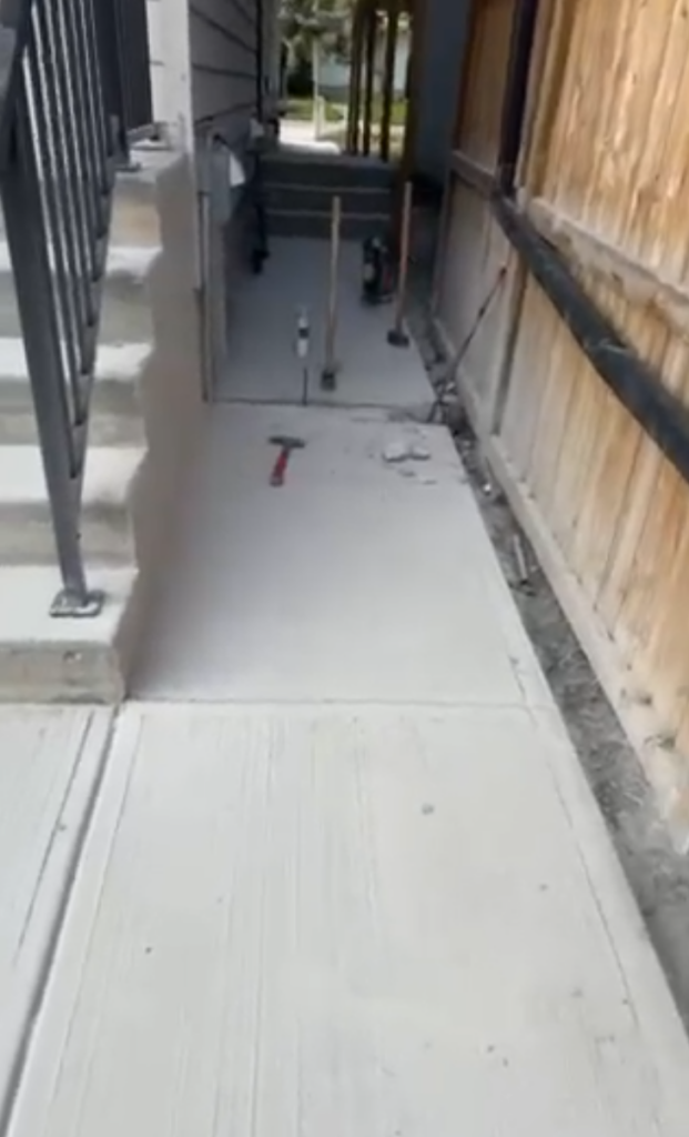 concrete repair/restoration to house walkway, rear-left corner of house view