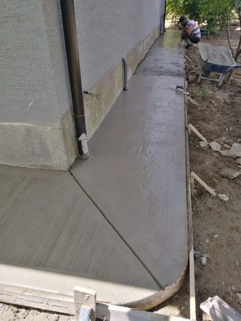 fresh-sidewalk-pour-house Freshly poured concrete sidewalk along a residential home by Concrete Star Calgary