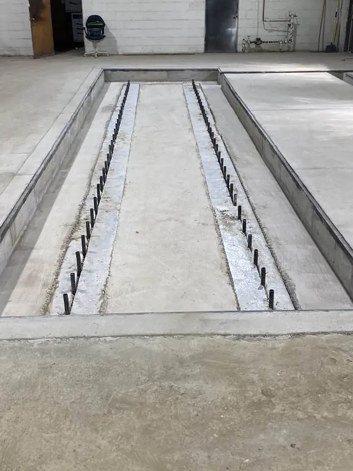 rebar prep work before pouring concrete for a commercial garage workshop