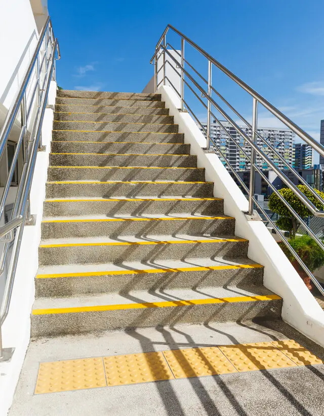 concrete stairs with yellow anti-slip stripe